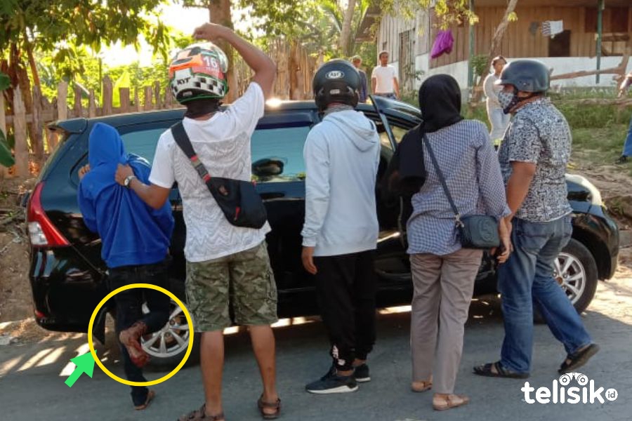 IN, tersangka pengedar sabu yang dilumpuhkan polisi saat digiring menuju Polres Muna. Foto: Sunaryo/Telisik
