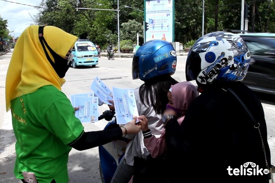 Tim pajak menyapa Bapenda Kota Kendari melakukan sosialisasi program pajak menyapa. Foto: Sumarlin/Telisik