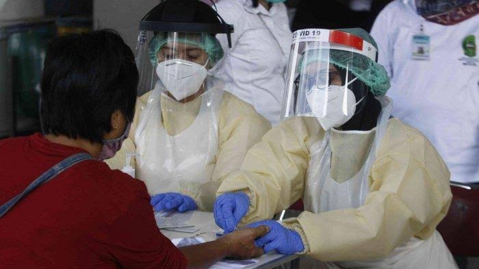 Pasien COVID-19 tetap diberikan kesempatan untuk menyalurkan hak pilihnya pada Pilkada 9 Desember 2020. Foto: Repro Tribunnews.com