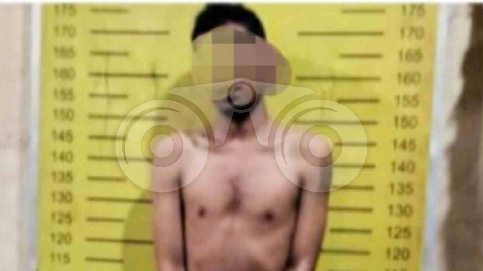 Pelaku Juanda yang nekat membakar istrinya saat beras di Polsek Percut Sei Tuan. Foto: Ones Lawolo/Telisik
