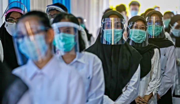 Peserta CPNS dengan Prokes COVID-19. Foto: Repro Warta Ekonomi