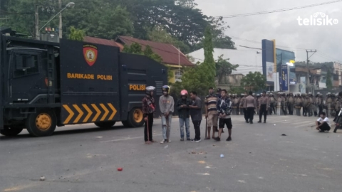 Aparat keamanan bersiaga mencegah terjadi bentrok susulan. Foto: Thamrin/Telisik