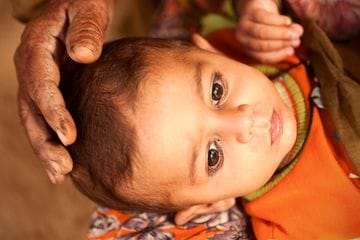 Ilustrasi seorang bayi. Foto: Repro Nationalgeographic