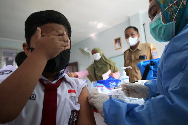 Ilustrasi vaksinasi COVID-19 pada anak usia 6 hingga 11 tahun. Foto: Repro katadata.co.id