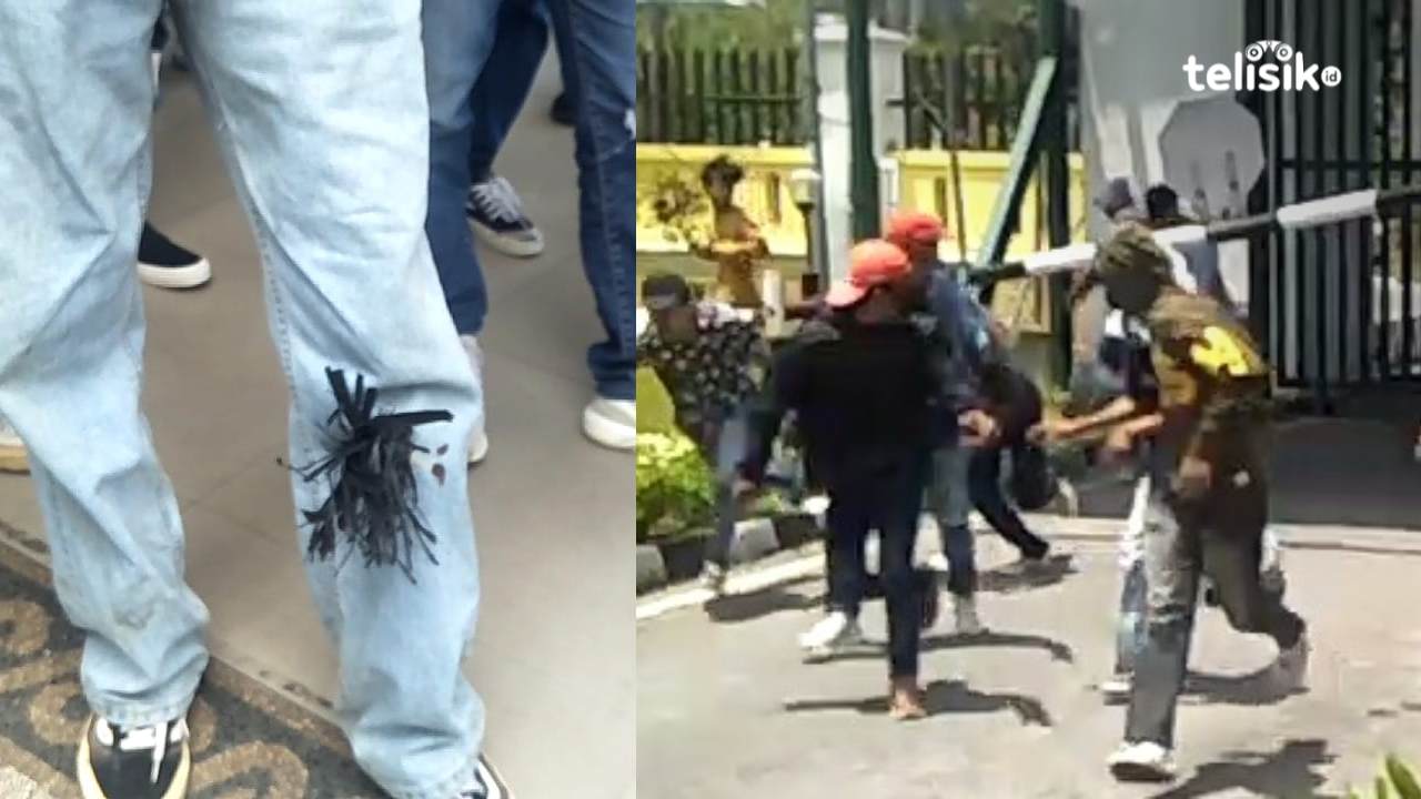 Massa yang berlari berusaha menyalamatkan diri dan salah satu massa menjadi korban terkena busur. Foto: Thamrin Dalby/Telisik